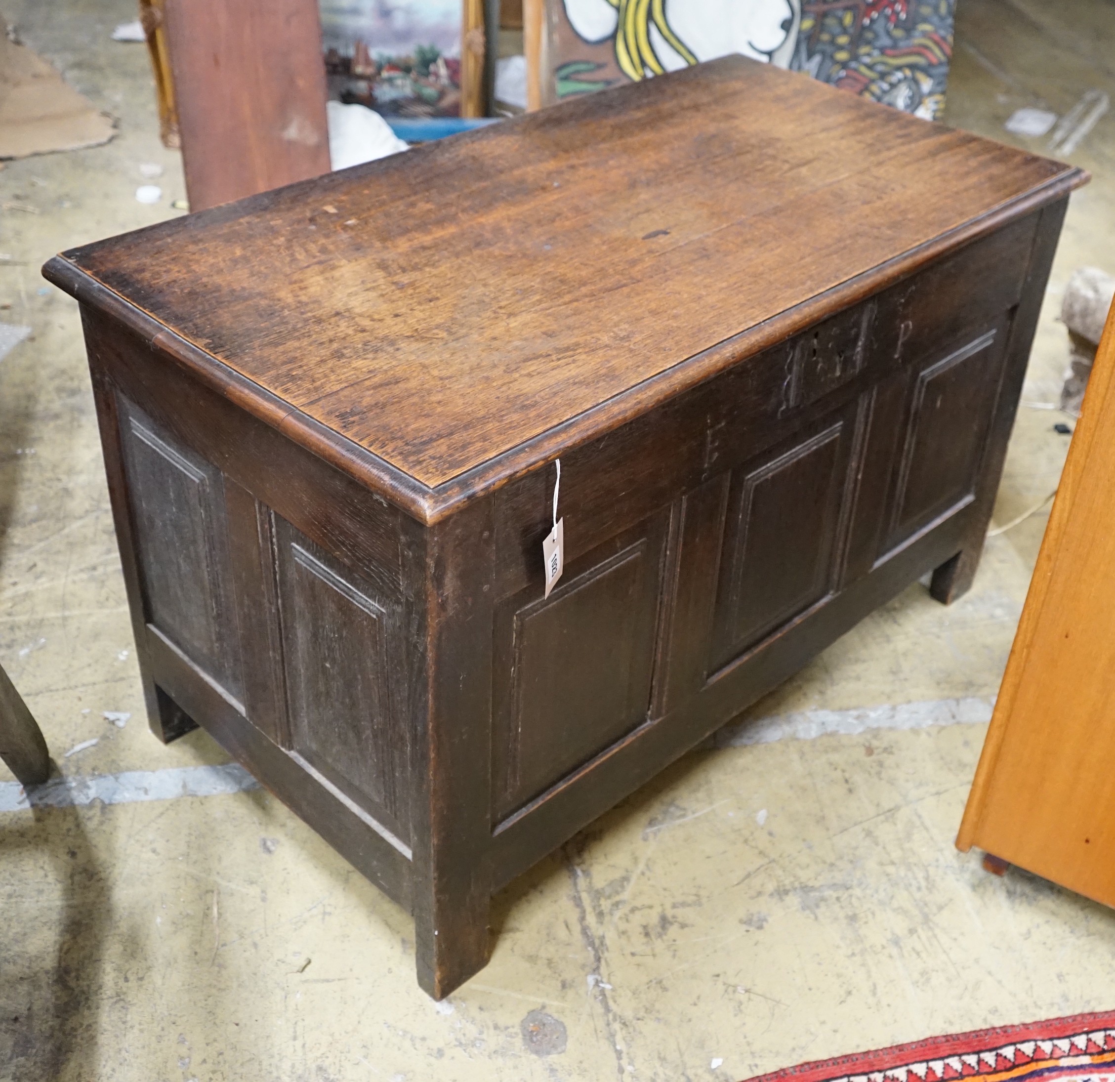An 18th century style panelled oak coffer, length 107cm, depth 55cm, height 63cm